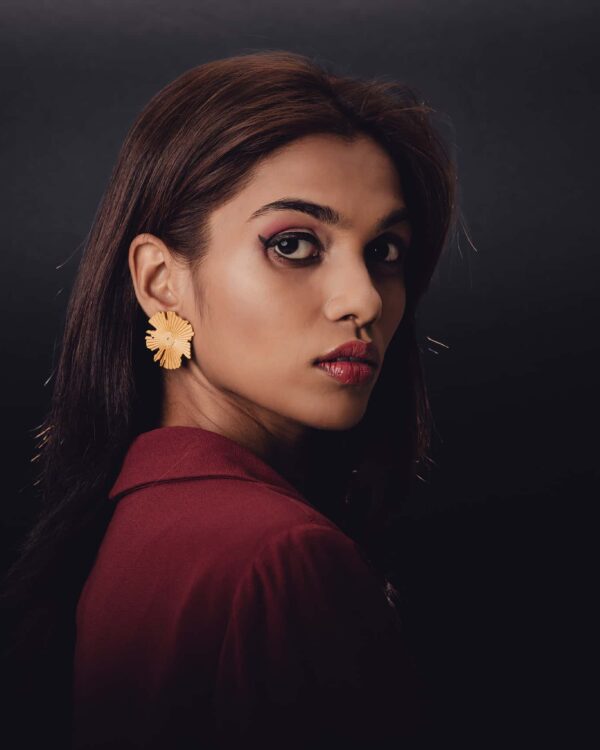 Golden floral statement earrings featured in Indian fashion jewelry collection for women.