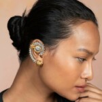 Vintage Indian jewelry ear cuff with intricate design, gold and silver finish, perfect for bridal or festive occasions.