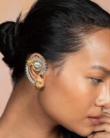 Vintage Indian jewelry ear cuff with intricate design, gold and silver finish, perfect for bridal or festive occasions.