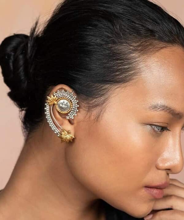 Vintage Indian jewelry ear cuff with intricate design, gold and silver finish, perfect for bridal or festive occasions.