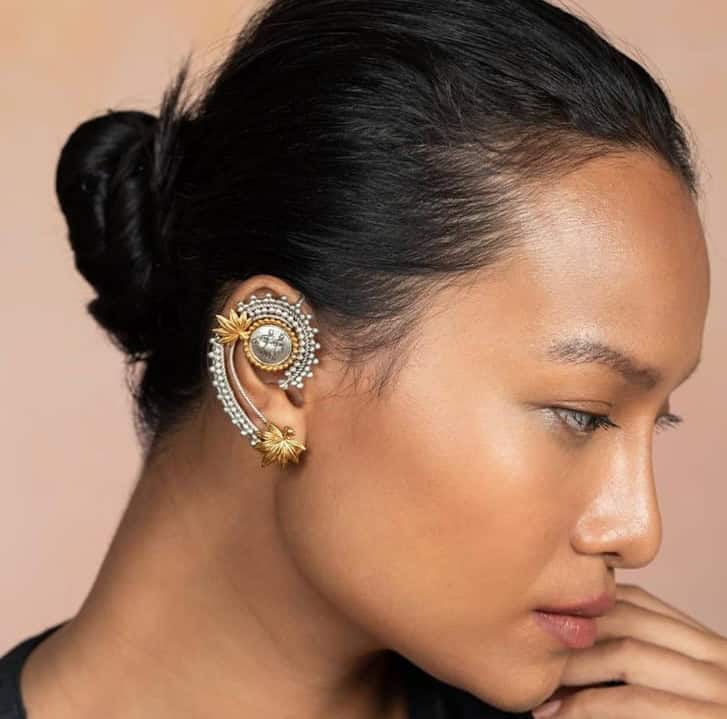 Vintage Indian jewelry ear cuff with intricate design, gold and silver finish, perfect for bridal or festive occasions.