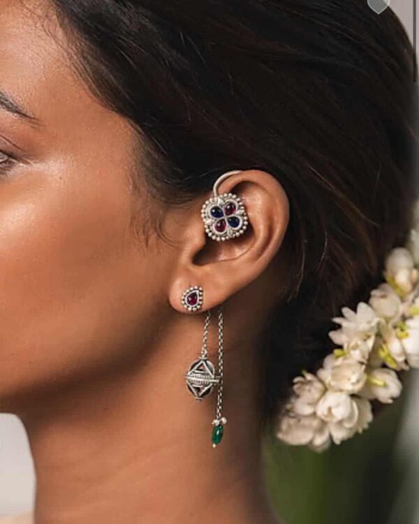 Elegant Indian jewelry earrings featuring a butterfly-shaped design embellished with colorful gemstones and intricate silver detailing, perfect for traditional fashion and special occasions.