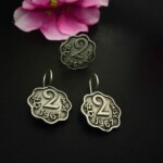 Vintage Indian jewelry earrings with "2 Paisa 1961" design, silver finish, traditional style, perfect for festive fashion accessories.