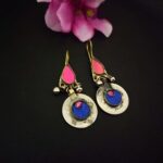 Colorful Indian boho earrings with pink, blue, and silver accents, perfect for traditional or contemporary Indian fashion jewelry styling.