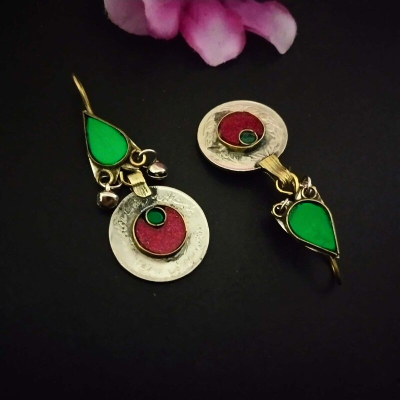 Colorful Indian ethnic earrings featuring green and red enamel details, intricate silver and gold-tone design, perfect for traditional jewelry and fashion accessories.