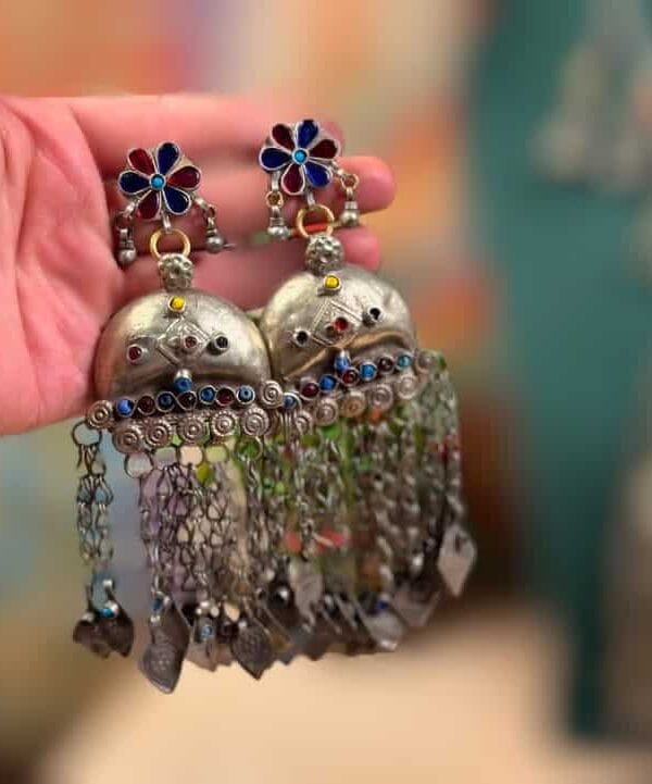 Intricate traditional Indian jhumka earrings with colorful beads and dangling chains, perfect for ethnic Indian fashion jewelry occasions.