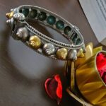 Intricate Indian silver and gold-plated jewelry bracelet with colorful beads, traditional design, handcrafted, perfect for ethnic fashion accessories, authentic Indian jewelry piece.