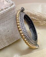 Intricate silver and gold Indian heritage jewelry bracelet featuring traditional bead and filigree designs, perfect for elegant cultural occasions and upscale jewelry collection.