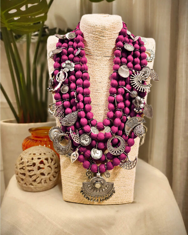 Gold-plated traditional Indian jewelry, silver necklace with lotus flower pendant, bohemian tribal jewelry, handcrafted ethnic ornaments, vibrant kundan jewelry set.