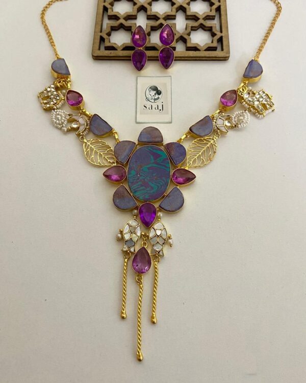Elegant Indian fashion jewelry set with purple and gold tones, featuring a statement necklace and matching earrings, perfect for traditional and festive occasions.