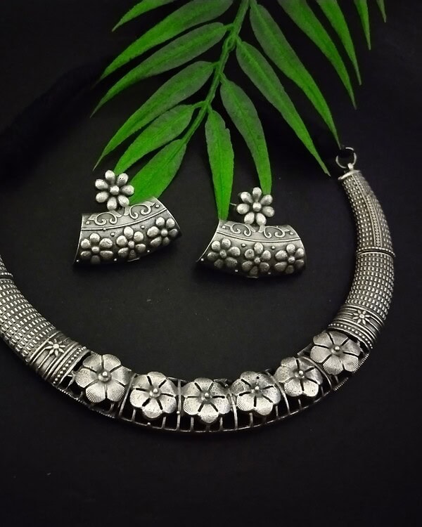 Antique silver floral jewelry set with necklace and earrings, traditional Indian oxidized jewelry design, perfect for festive or ethnic occasions.