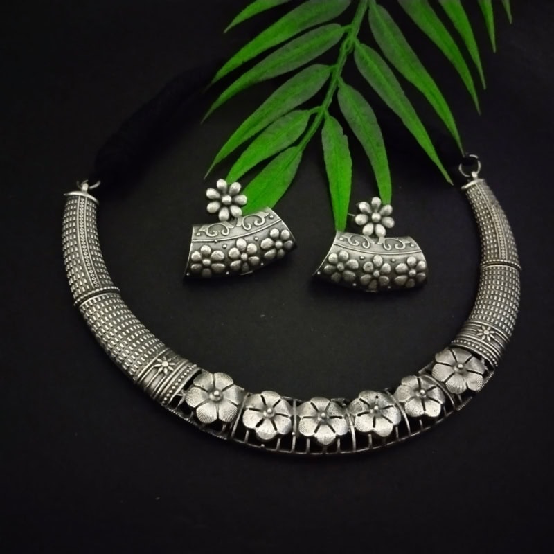 Antique silver floral jewelry set with necklace and earrings, traditional Indian oxidized jewelry design, perfect for festive or ethnic occasions.