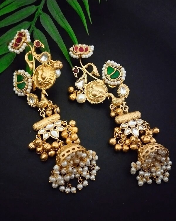 Gold plated traditional Indian earrings with pearl and colored stone embellishments perfect for festive occasions and weddings.