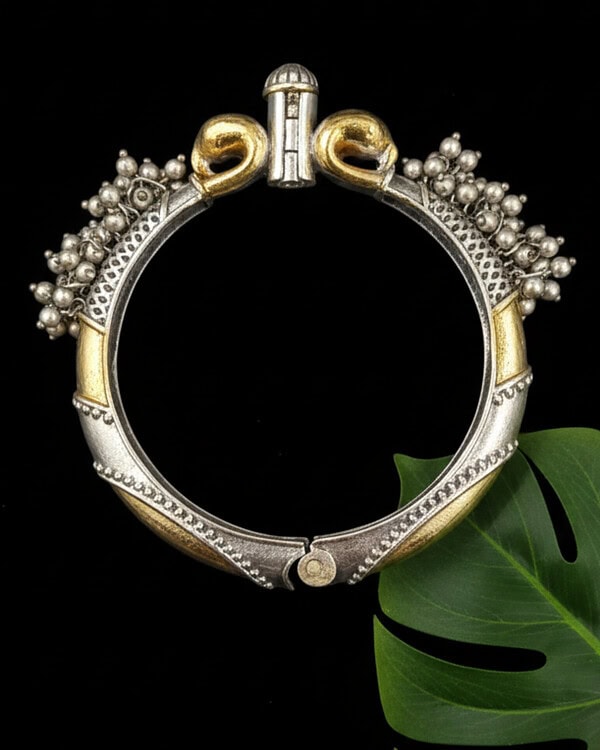 Vintage Indian silver and gold-plated ethnic jewelry bracelet with intricate beadwork and detailed design, perfect for traditional Indian fashion accessories.