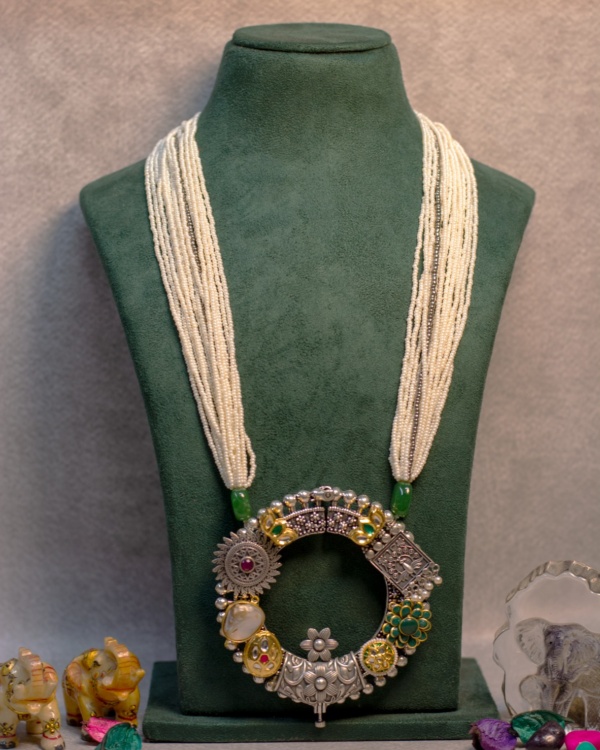 Elegant multi-strand Indian fashion jewelry necklace with intricate silver and colorful embellishments, perfect for traditional and festive occasions.