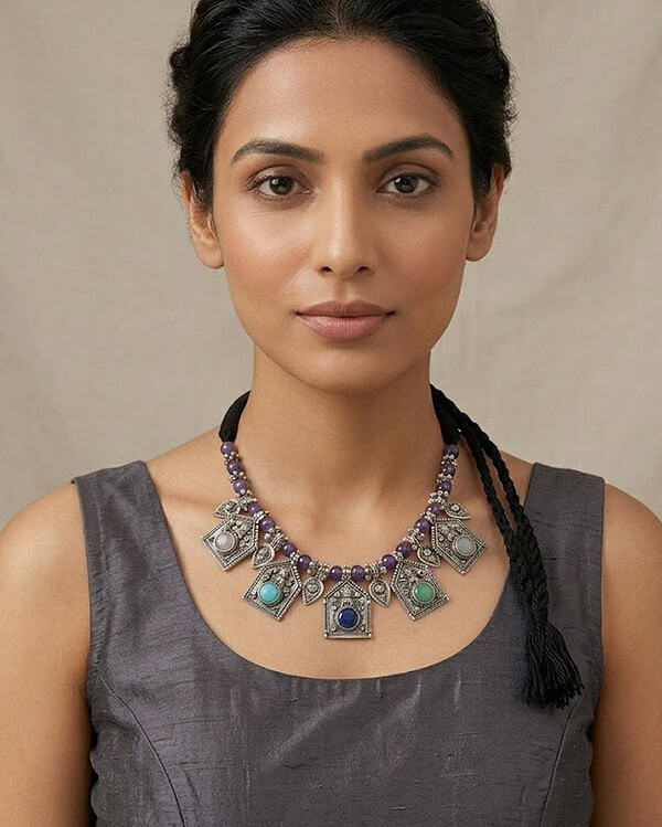 Beautiful handcrafted Indian jewelry necklace featuring colorful stones and intricate silver designs, perfect for traditional and festive occasions.